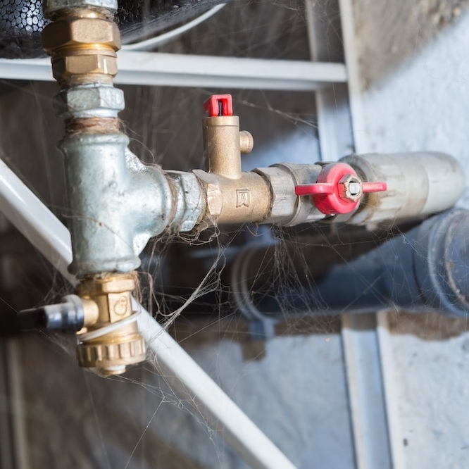 A pipeline going through a basement.